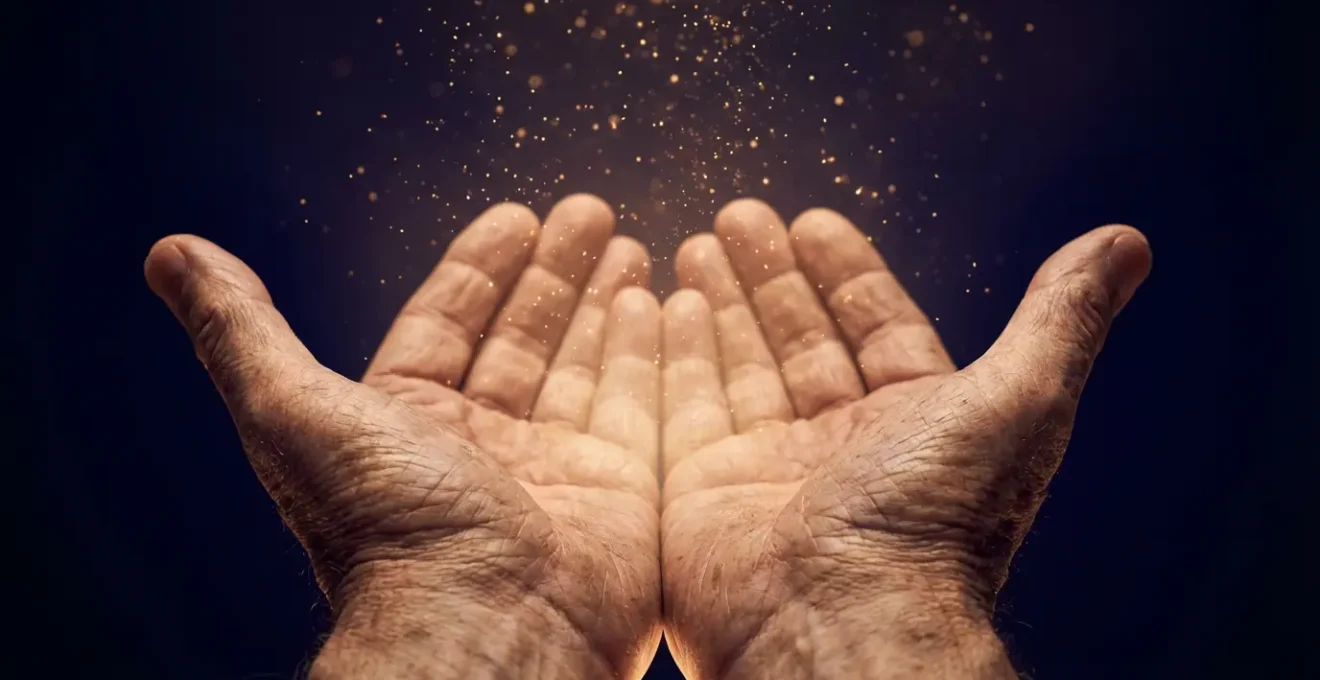 Two hands cupped together releasing golden light particles upward, representing the act of forgiveness and service