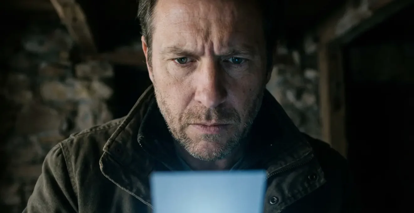 Investigator analyzing data patterns on tablet during night investigation